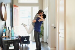 A couple hugging after finding their dream rental