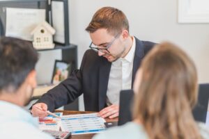 A real estate agent looking at a paper