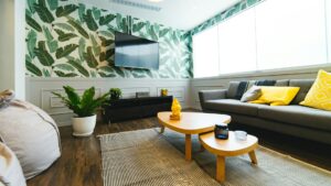 A cozied-up rental home with wallpaper and a rug added as part of the rental-friendly upgrades.